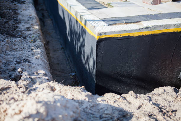 Professional Waterproofing technician working in Plantersville, AL